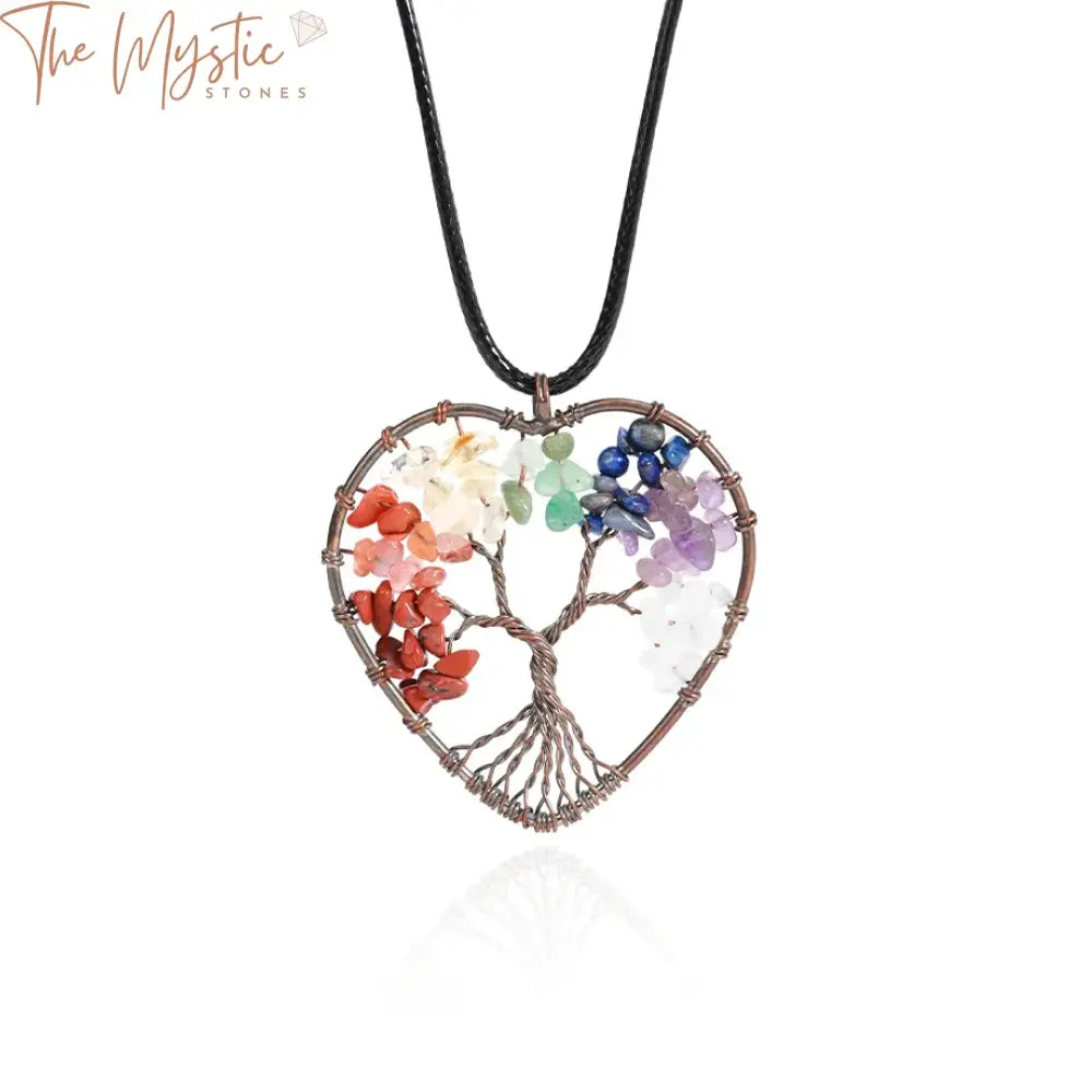 A vibrant Tree of Life pendant necklace features intricately designed branches and roots intertwined in a circular frame.