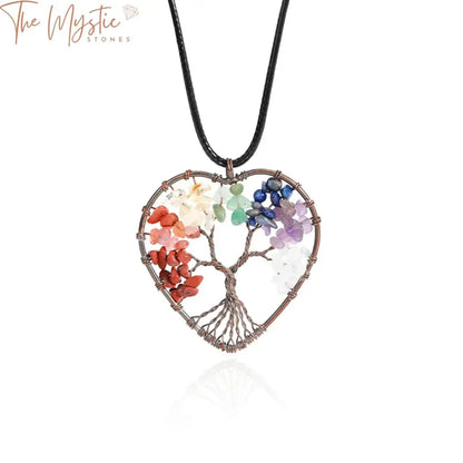 A vibrant Tree of Life pendant necklace features intricately designed branches and roots intertwined in a circular frame.