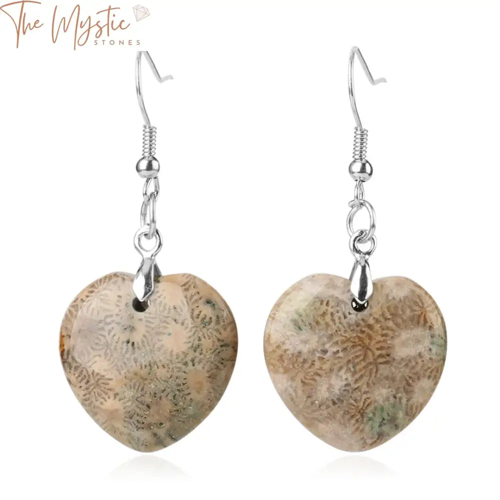 A pair of natural chrysanthemum stone dangle earrings featuring heart-shaped ammonite designs, hanging elegantly from hooks.