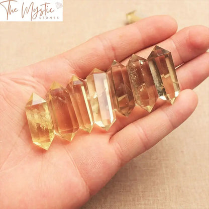 A single natural citrine crystal wand, measuring 40-50mm in length, with a double-terminated hexagonal shape.