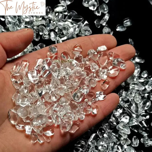 A collection of small, natural clear quartz crystal chips ranging from 7-9mm in size.