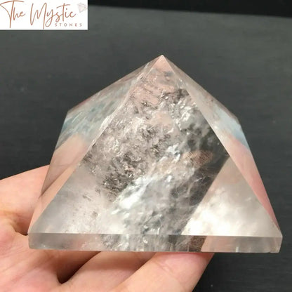 A 50mm clear quartz crystal pyramid, polished to a smooth finish, is displayed on a plain background.