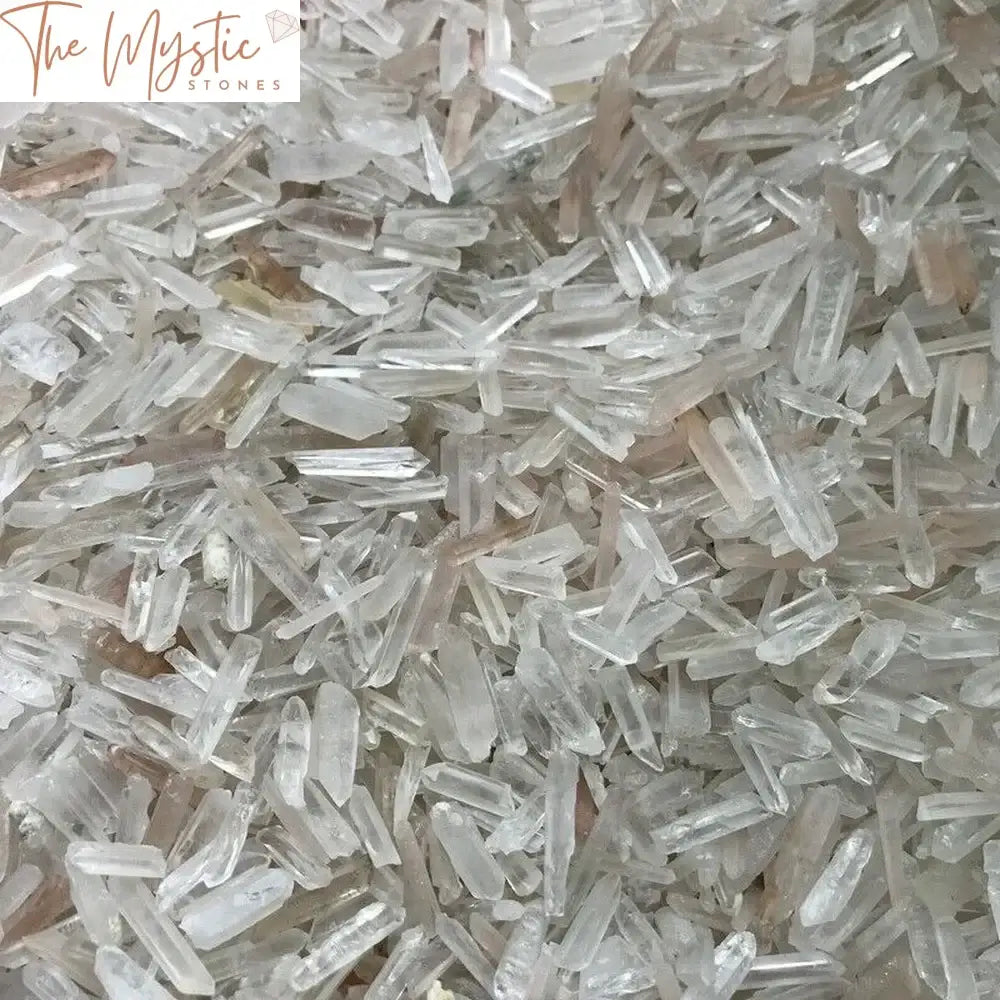 A collection of numerous natural clear quartz crystal points weighing 250 grams.