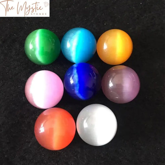 A single polished 20mm cat eye sphere made of colorful quartz crystal.