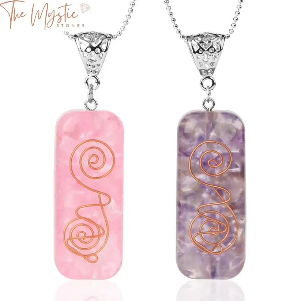 A rectangular pendant featuring an array of colorful natural chip stones representing the 7 chakras, encased in clear resin.