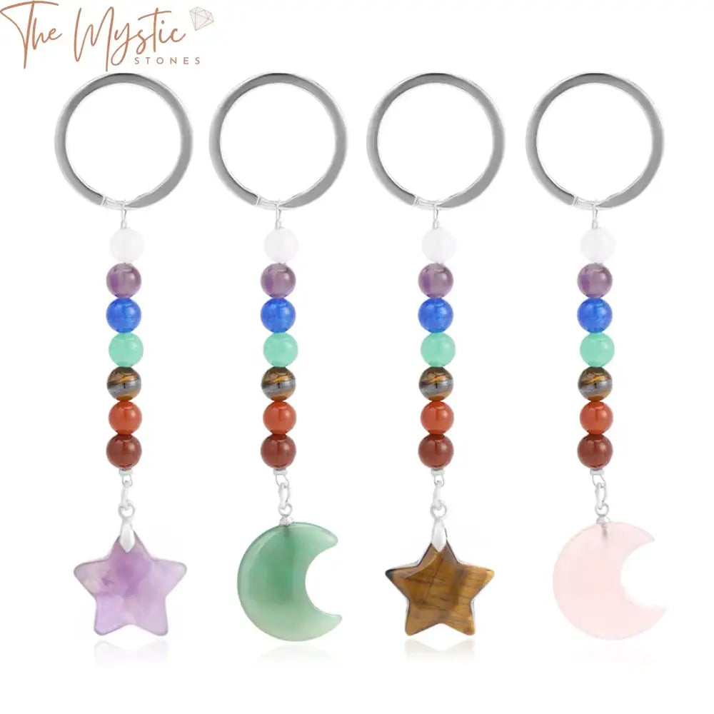 A crescent moon crystal keychain featuring a star-shaped pendant made from natural stones representing the seven chakras.