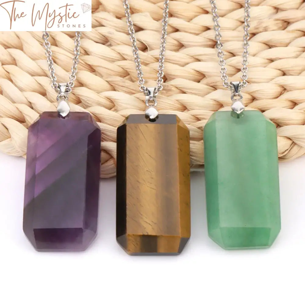 A natural stone crystal pendant shaped like a coffin, attached to a trendy stainless steel chain necklace.