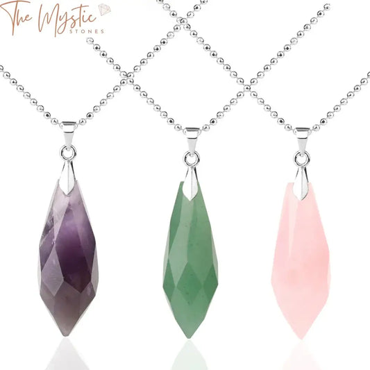 A collection of natural crystal pendant necklaces is displayed, featuring multi-faceted designs.