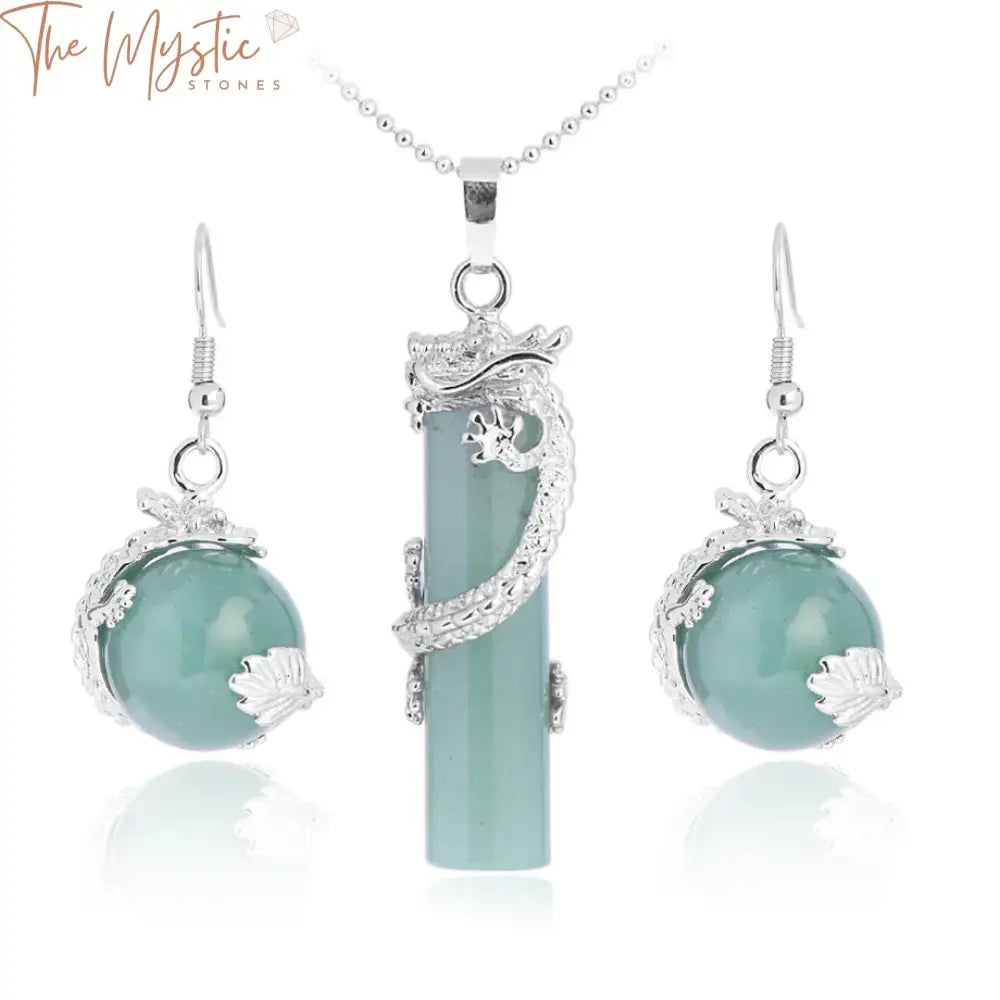 A jewelry set featuring a necklace with a round crystal pendant, opal stone centerpiece, and beaded design.