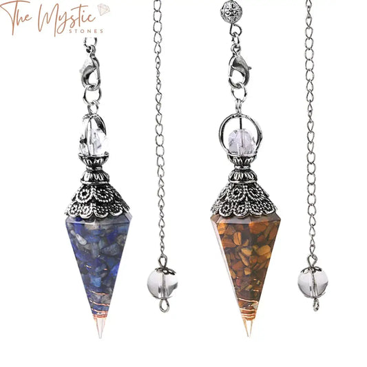 A close-up image of an antique divination pendulum featuring a clear crystal quartz pendant carved into a cone shape.