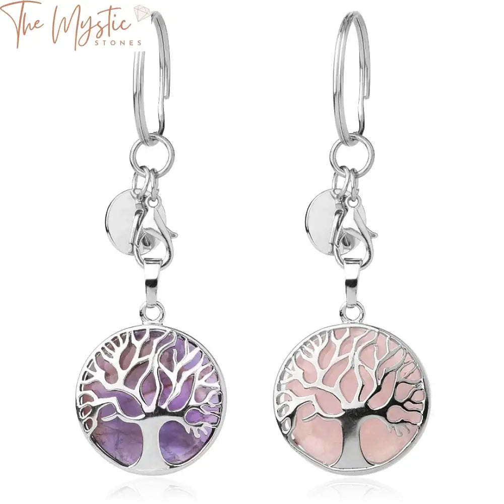 A keychain featuring a metal tree of life design with branches adorned with small, colorful natural crystal stones.