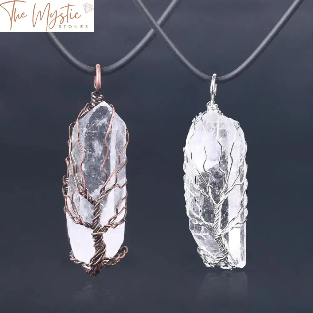 A pendant featuring a natural crystal pillar is intricately wrapped with antique copper wire forming a Tree of Life design.