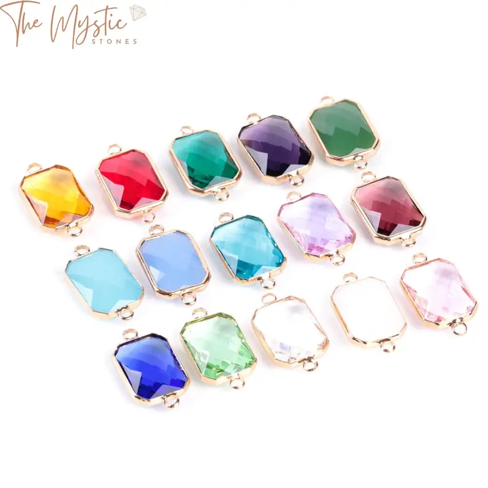 A collection of colorful and shimmering square-shaped glass crystal beads in various hues, arranged neatly.