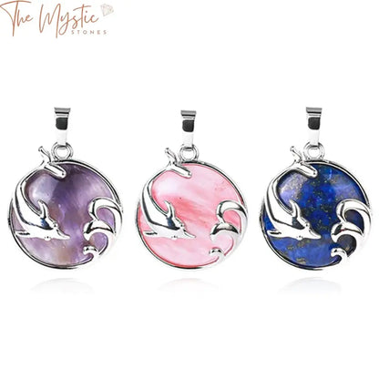 A handcrafted dolphin-shaped pendant made from a polished natural stone cabochon crystal.