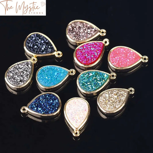 A collection of high-quality druzy beads in a water drop shape, featuring a shimmering surface with a gold-color border.