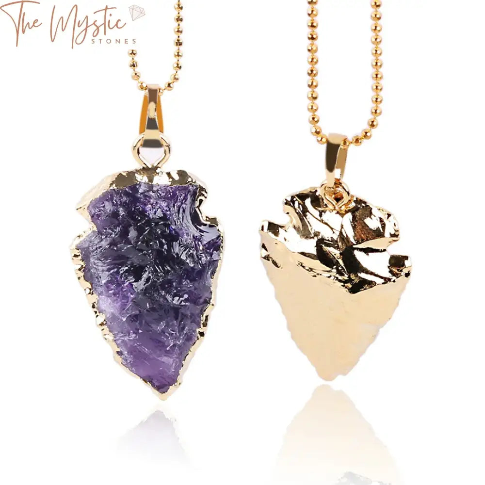 A selection of arrowhead-shaped necklaces featuring natural purple rock crystal quartz pendants.