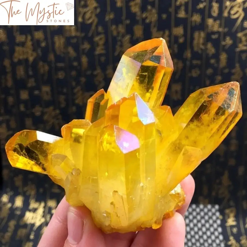 A vibrant yellow quartz crystal cluster with a shimmering electroplated finish, displaying intricate and jagged formations.