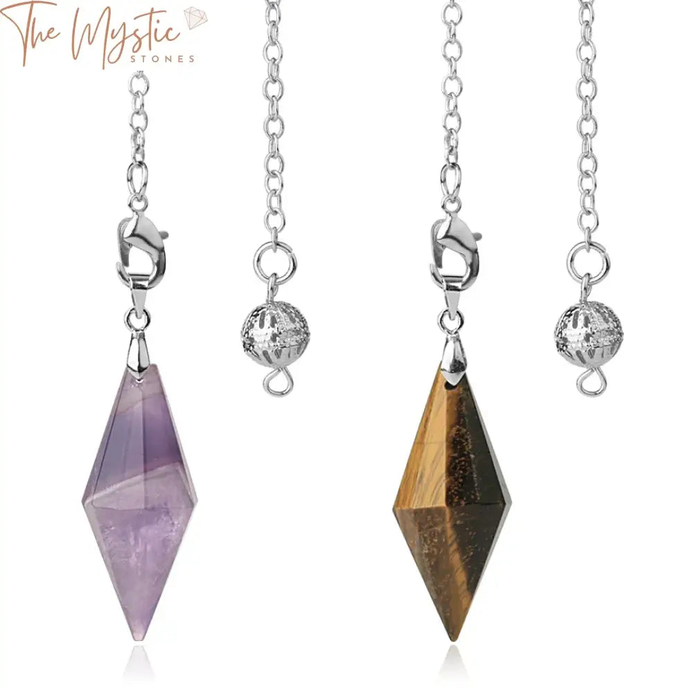 A collection of natural stone pendulum pendants displayed on a flat surface.