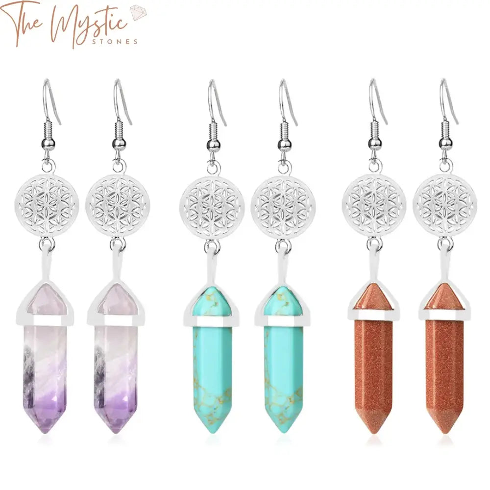 A pair of dangle earrings featuring hexagonal pendants made of purple quartz stones.