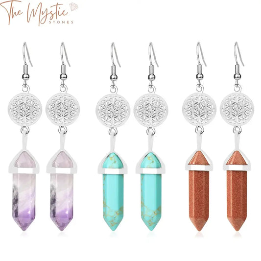 A pair of dangle earrings featuring hexagonal pendants made of purple quartz stones.