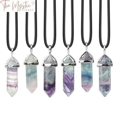 A collection of Natural Fluorite Necklace Pendants displayed on a soft, neutral background.