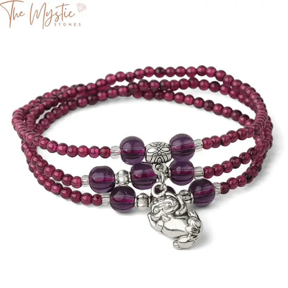 A delicate multilayer bracelet featuring 3mm garnet beads, each layer adorned with rich, red stones.