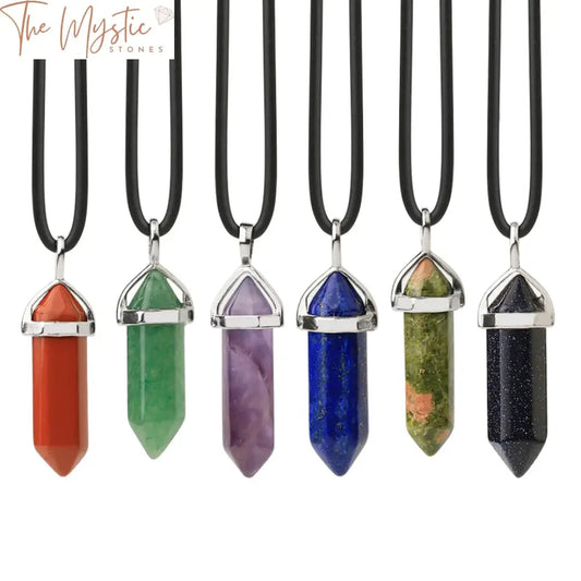 A collection of crystal necklaces featuring natural gemstone pendants shaped like hexagonal bullets.