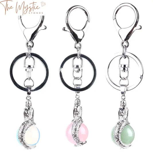 A collection of elegant mermaid-themed keychains featuring natural gemstone pendants.