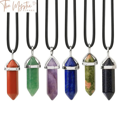 A selection of crystal necklaces displaying various natural gemstones in hexagonal bullet-shaped pendants.