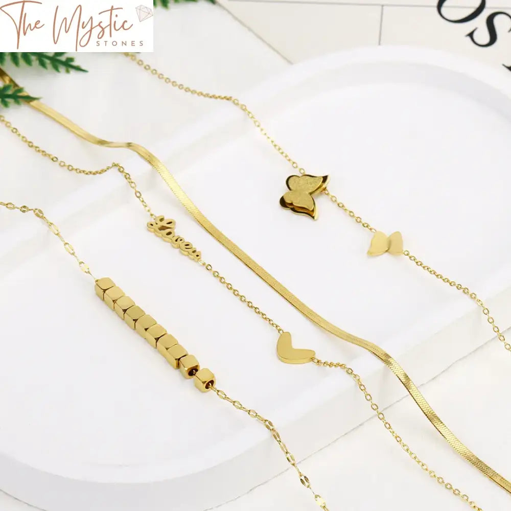 A luxury double-layer necklace on display, featuring a gold-colored stainless steel chain.