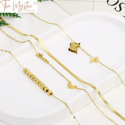 A luxury double-layer necklace on display, featuring a gold-colored stainless steel chain.