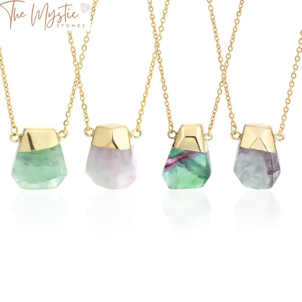 A stunning necklace featuring an irregularly faceted fluorite crystal pendant in vibrant shades of green and purple.