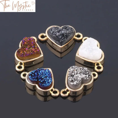 A collection of love-shaped charms made from drusy druzy natural crystal stones, featuring a shimmering surface.