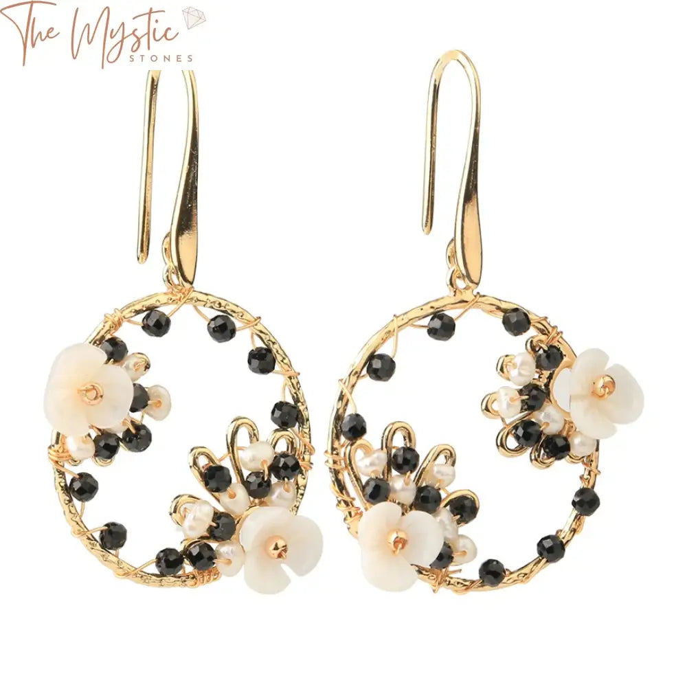 A pair of handmade luxury earrings featuring round natural stone beads in a trendy design.