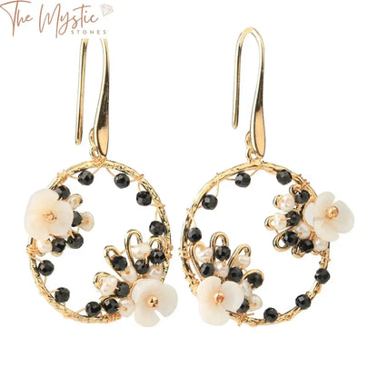 A pair of handmade luxury earrings featuring round natural stone beads in a trendy design.