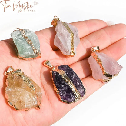 A collection of irregularly shaped natural crystal stones, including rose quartz, fluorite, and amethyst.