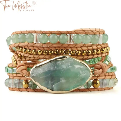 A braided bracelet featuring green aventurine beads is elegantly wrapped around itself.