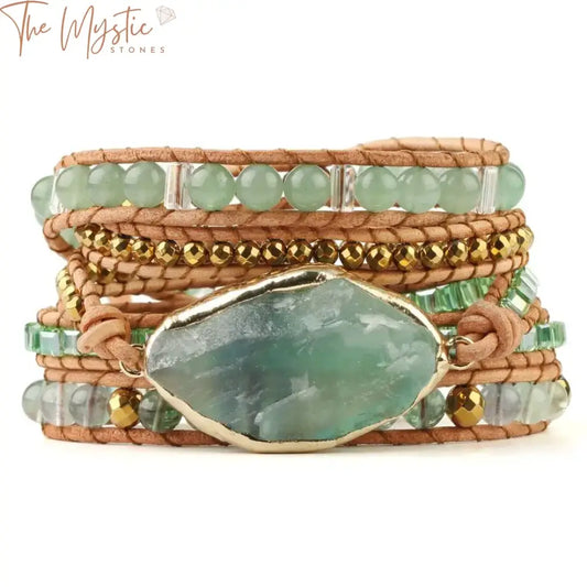 A braided bracelet featuring green aventurine beads is elegantly wrapped around itself.