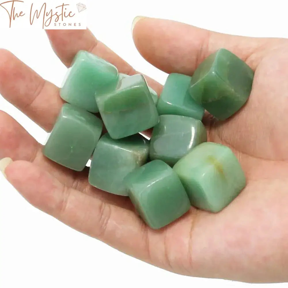 A collection of smooth, polished green aventurine stones in various tumbled shapes and cubic blocks, displayed together.