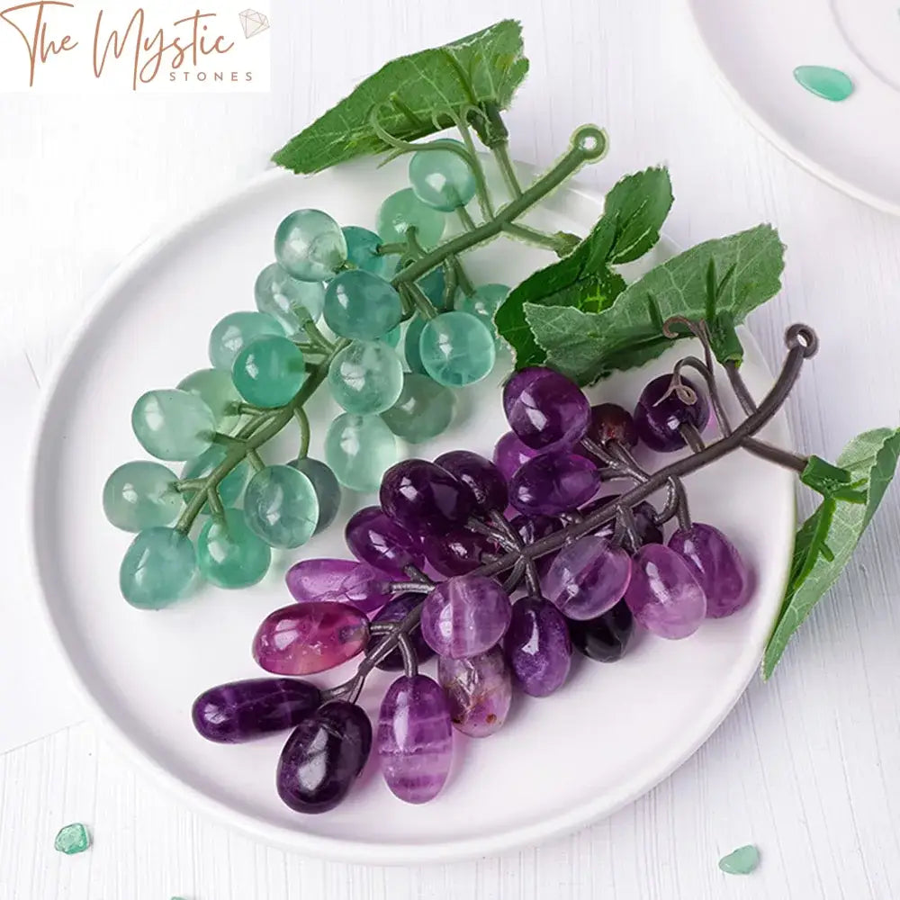 A cluster of hand-carved grape-like spheres made from natural green fluorite, with a translucent and smooth surface.