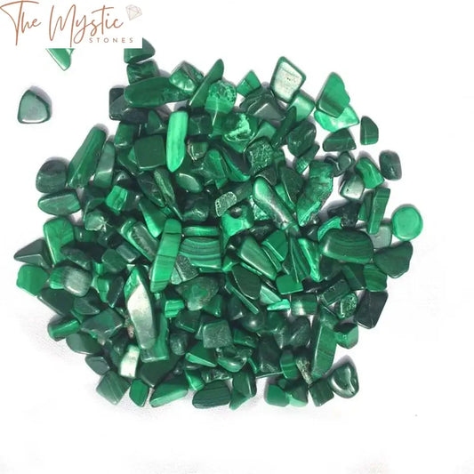 A collection of natural green malachite gravel stones, each with unique patterns and shades of vibrant green.