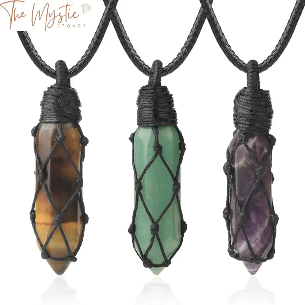 A collection of healing crystal necklaces displayed on a flat surface.