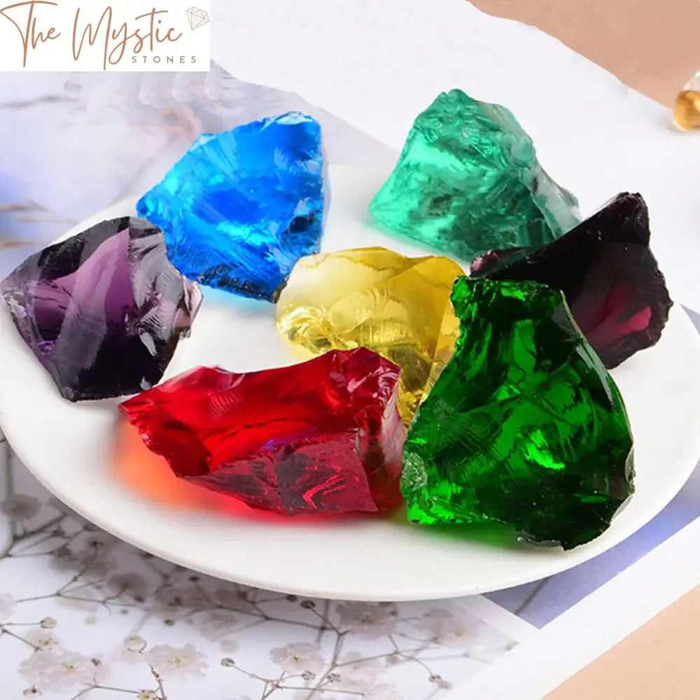 A collection of irregularly shaped, multicolored glass stones with a glossy, glazed surface.