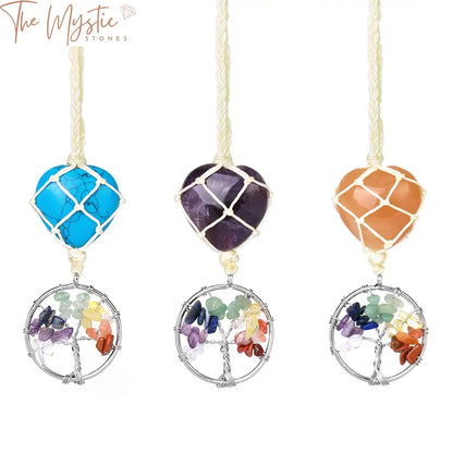 A heart-shaped pendant featuring the 7 Chakras Tree of Life design adorned with natural tumbled crystal stones.