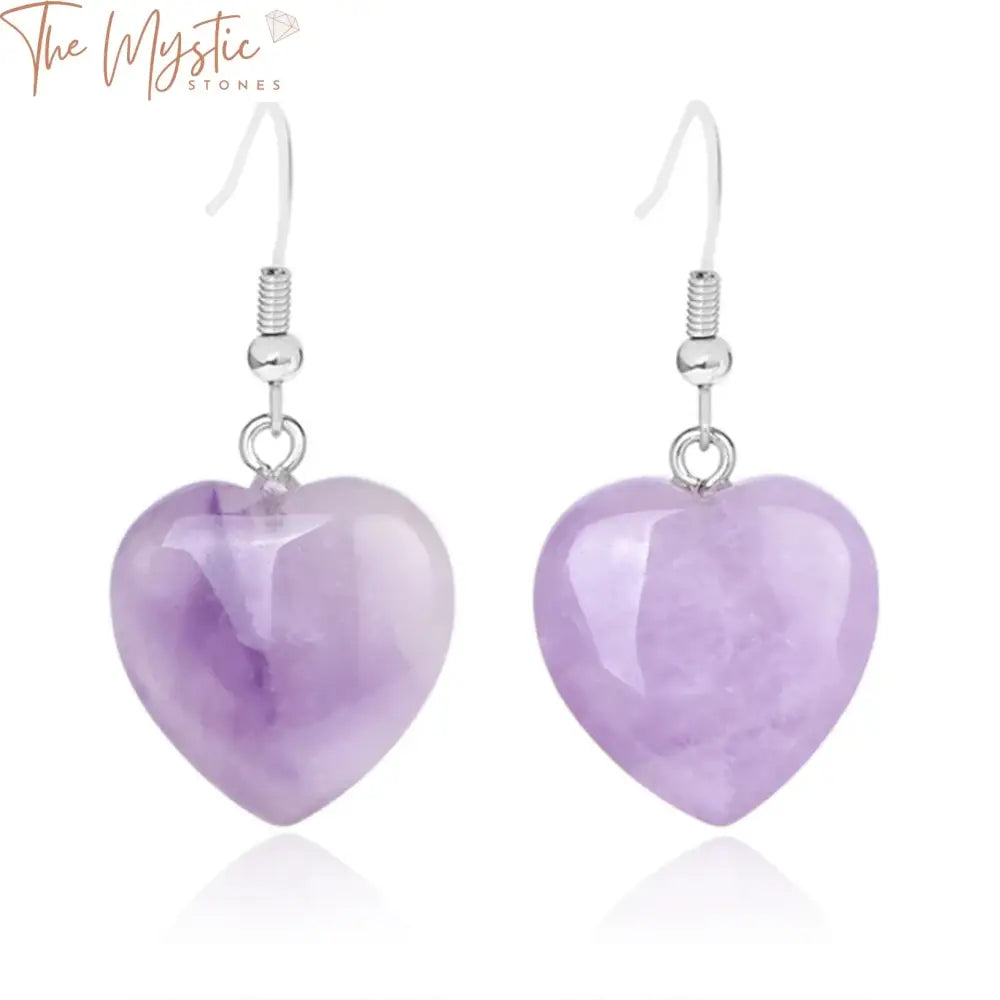 A pair of elegant drop earrings featuring heart-shaped pink and purple quartz crystals.