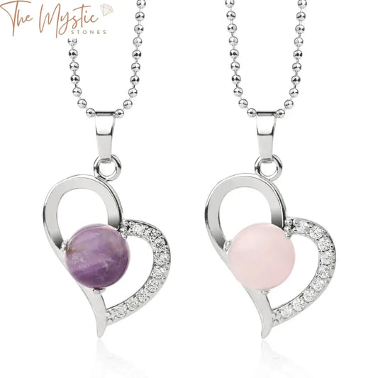 A collection of heart-shaped pendants, each made from natural semi-precious stones, displayed on delicate necklaces.