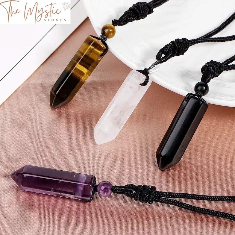 A hexagonal natural stone pendant necklace featuring three different crystals—amethyst, tiger eye, and black obsidian.