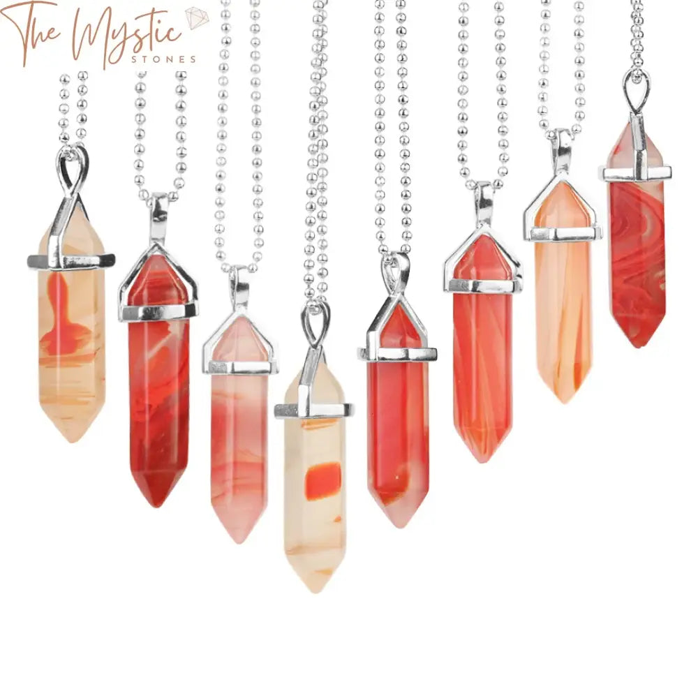 A collection of vibrant stone healing pendants shaped like pointed bullets.