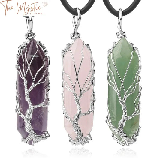 A hexagonal pendant featuring a natural quartz crystal wrapped in silver-colored wire forming a delicate life tree design.