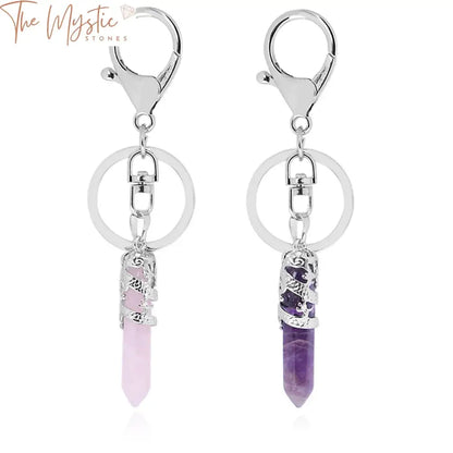 A collection of natural gemstone keychains featuring hexagonal prism point pendants.